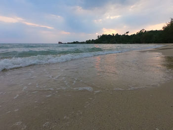 Scenic view of beach against sky during sunset