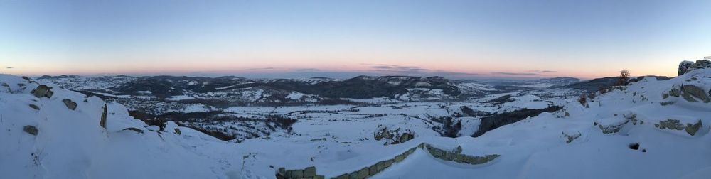 Scenic view of mountains against sky during winter