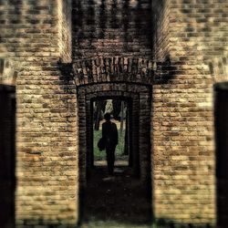 Shadow of person on brick wall