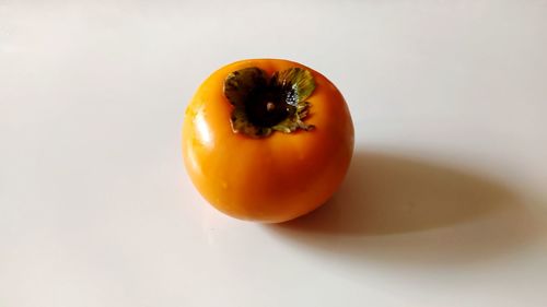 Close-up of orange on white background