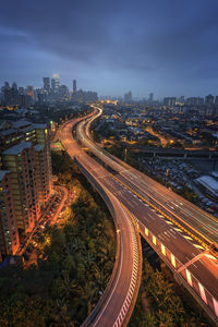 High angle view of light trails on road in city