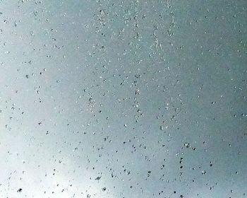 Close-up of water drops on glass