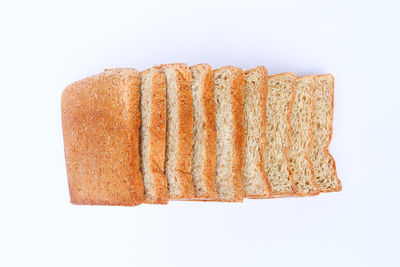 High angle view of bread against white background