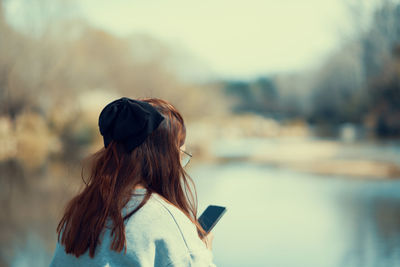 Woman texting with her phone