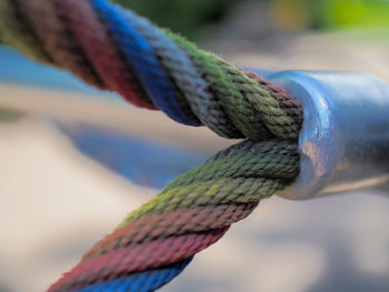 Close-up of rope tied on metal