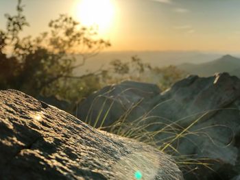 Close-up of sea against sky at sunset