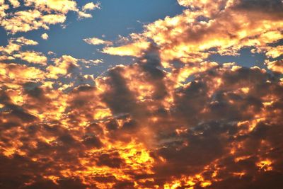 Low angle view of dramatic sky during sunset