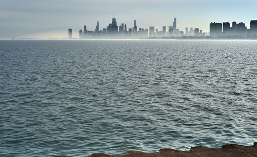 Sea and buildings in city