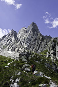 Scenic view of mountains and rocks against sky