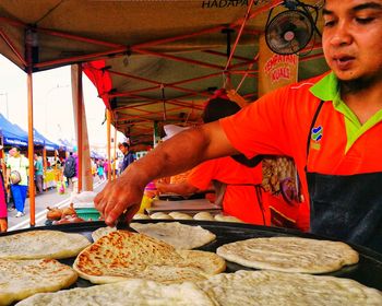 Man working at market stall