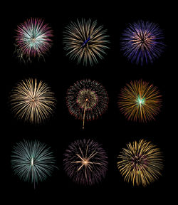 Low angle view of firework display against black background