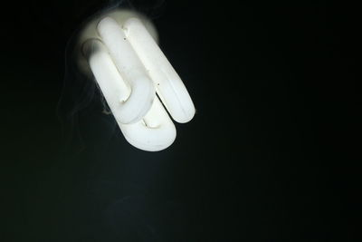 Close-up of illuminated light bulb
