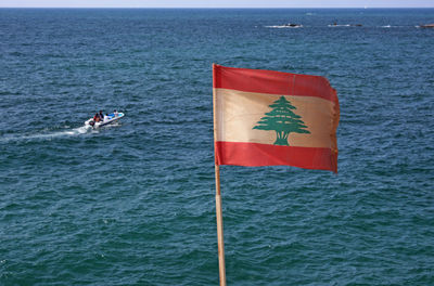 Lebanese flag waving at the coast of beirut, lebanon