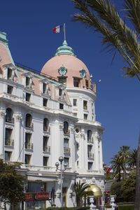 Low angle view of building against blue sky