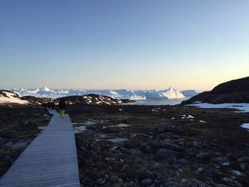 Scenic view of mountains against clear sky during winter