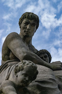 Low angle view of statue against sky