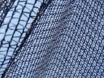 Low angle view of chainlink fence