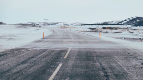 Road along snow covered landscape