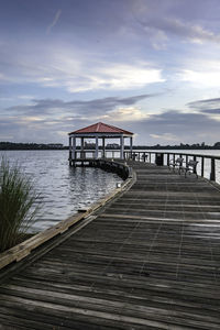 Pier over lake against sky