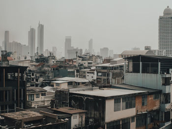 Buildings in city against sky