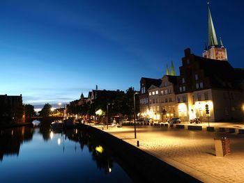 Reflection of illuminated buildings in water