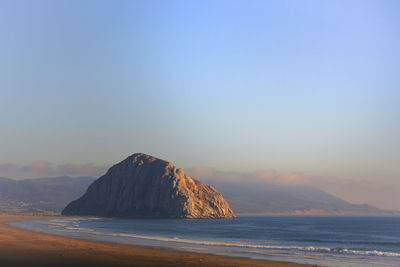 Scenic view of sea against clear sky during sunset