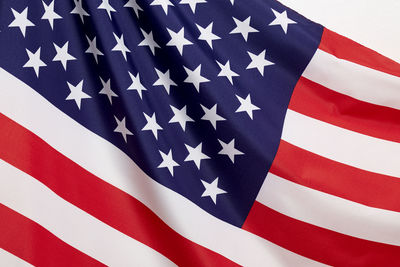 Close-up of american flag against white background