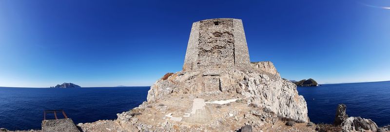 Scenic view of sea against blue sky