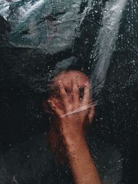 Close-up of young woman in water