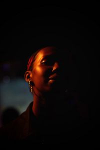 Close-up portrait of young woman looking away