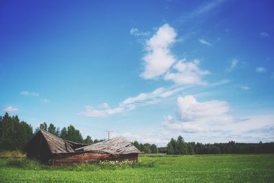 House on field against sky