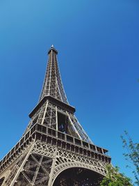 Low angle view of eiffel tower against blue sky