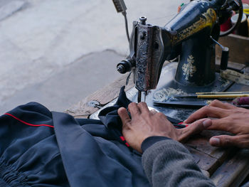 Midsection of man working in workshop