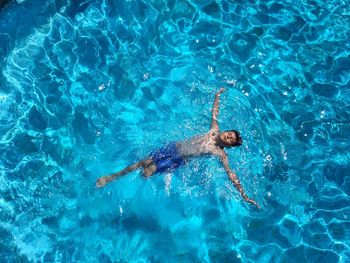 High angle view of man swimming in pool