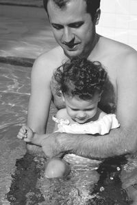 Portrait of a girl sitting in water