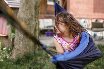 Low angle view of girl wearing hat