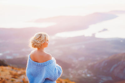 Rear view of woman looking at mountain