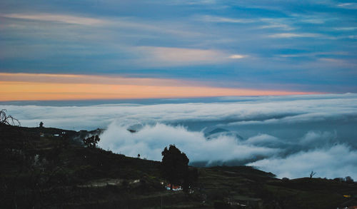 Scenic view of landscape against sky during sunset