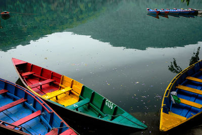 High angle view of boats moored in lake, pokhara, nepal