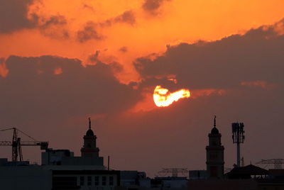 Silhouette of buildings at sunset