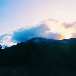 Scenic view of mountains against sky during sunset