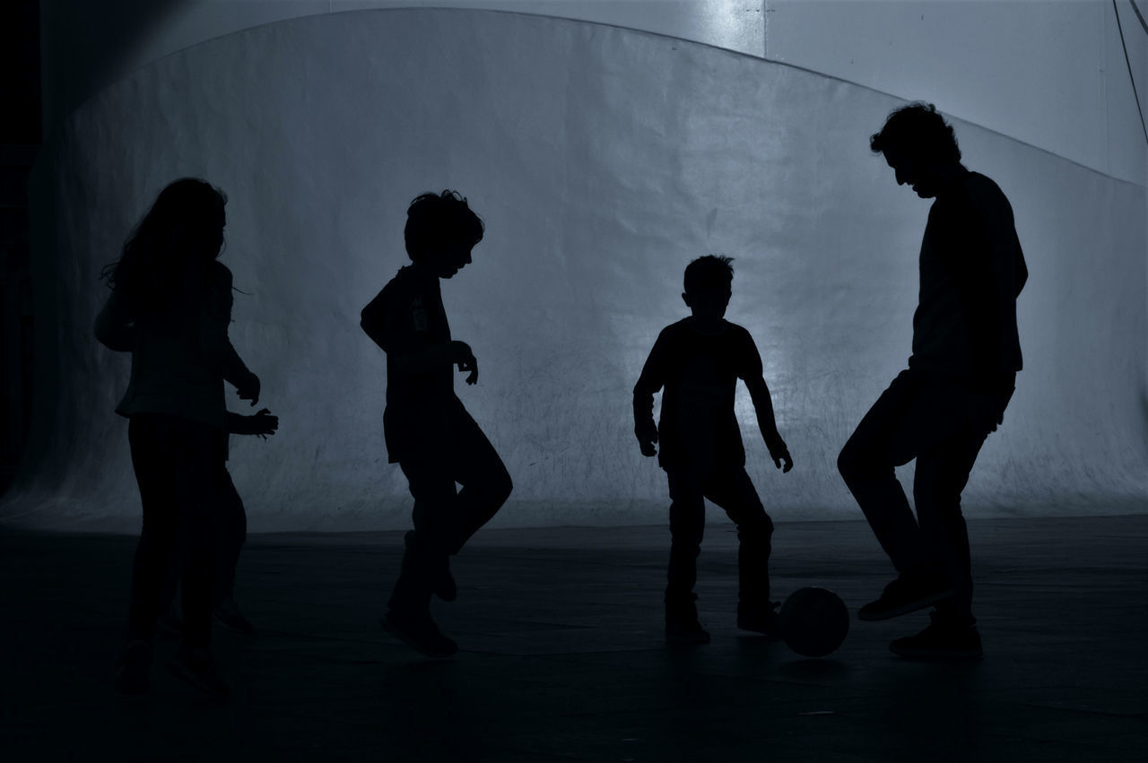 SILHOUETTE PEOPLE STANDING IN KITCHEN