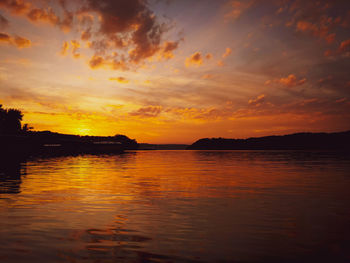 Scenic view of sea against romantic sky at sunset