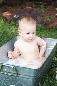 A baby boy with chocolate on his face.