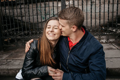 Portrait of happy couple kissing