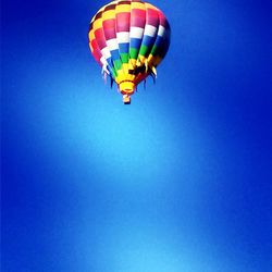 Low angle view of multi colored balloons