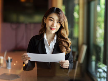 Portrait of smiling young woman