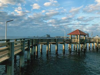 Pier over sea against sky