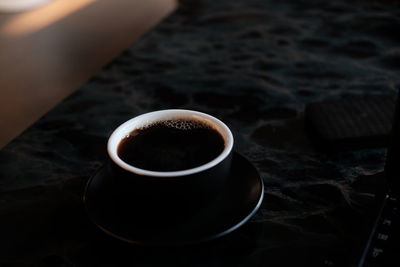 Close-up of coffee cup on table