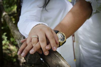 Close-up of man holding hands